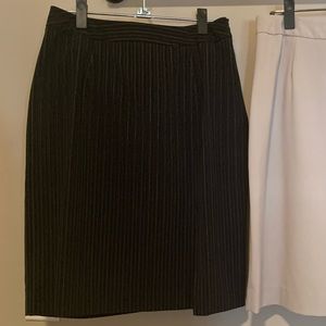 Pinstripe black pencil skirt w over the knee slit.
